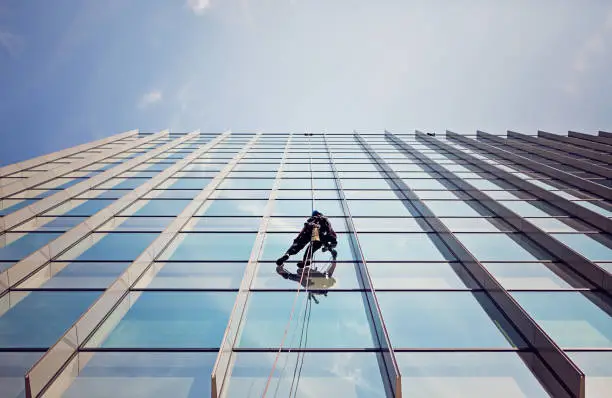 Camelot crew performing high-rise rope-access window cleaning in Nashville