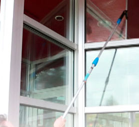 Camelot crew cleaning commercial storefront windows in Nashville, TN